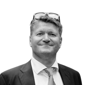 Portrait of a business man with glasses on his head